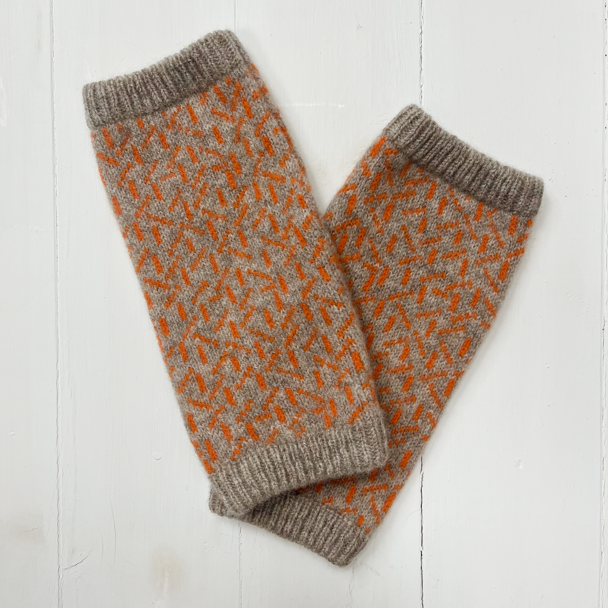 Scatter wrist warmers - cobble and orange soda