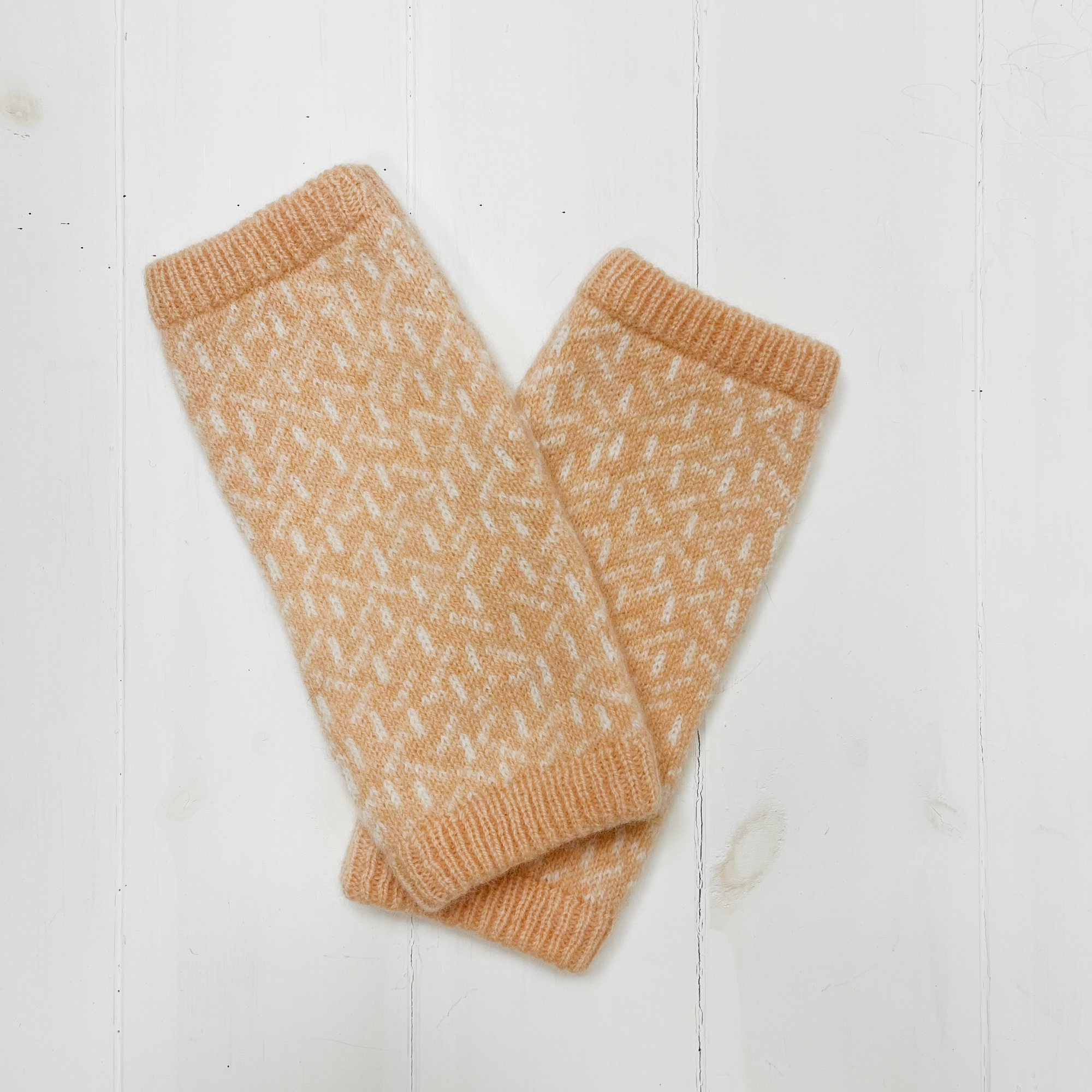 Scatter wrist warmers - nectarine and white